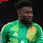 Manchester United goalkeeper Andre Onana in action during a match, reacting after a defensive mistake.