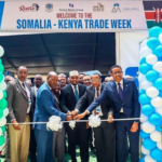 Kenyan and Somali officials cutting a ribbon at the Somalia-Kenya Trade Week event in Nairobi, symbolizing stronger economic ties between the two nations.