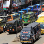 A Kawangware 46 matatu parked in Nairobi CBD with passengers boarding.