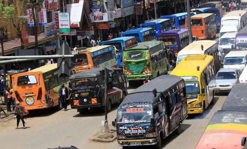 A Kawangware 46 matatu parked in Nairobi CBD with passengers boarding.