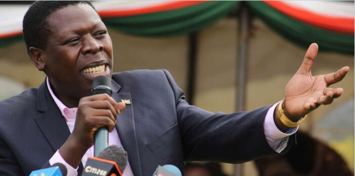 Eugene Wamalwa speaking at a political event, addressing claims about AI being used in propaganda.