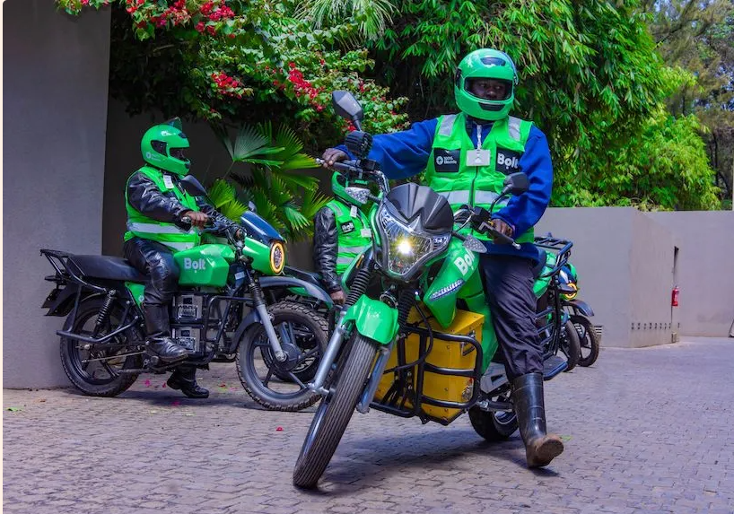 A fleet of Bolt electric motorbikes lined up in Nairobi, highlighting Kenya’s shift toward sustainable urban transport.