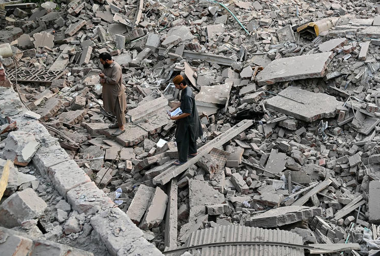 Emergency responders and police secure the site of a reported explosion near Sharafi Goth in Karachi, Pakistan, as tensions escalate with India.