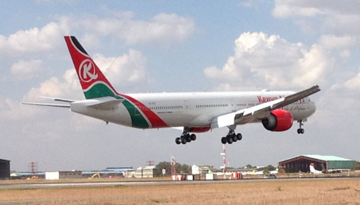 Kenya Airways Boeing 787-8 aircraft on the runway under cloudy skies.