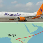 Akasa Air airplane parked at airport beside a map illustrating planned India–Kenya route