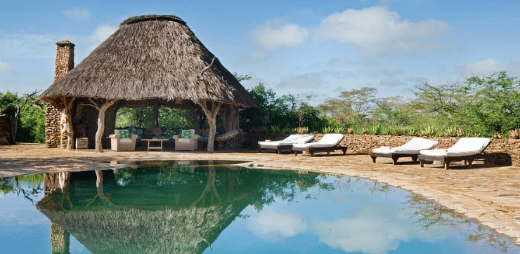 A serene poolside retreat at El Karama Lodge, where luxury meets the untouched beauty of Laikipia.
